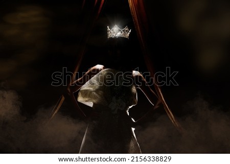 Silhouette of Miss Beauty Pageant Contest Woman with sparkle Diamond Crown with tanned skin beautiful makeup evening gown on stage with lighting curtain and dark background Royalty-Free Stock Photo #2156338829