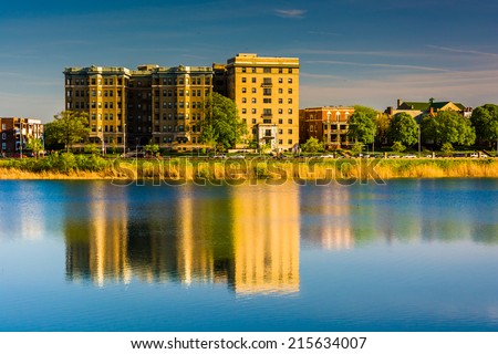 Buildings reflecting in Druid Lake, at Druid Hill Park in Baltimore, Maryland.