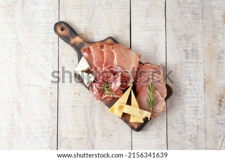 Appetizers table with different antipasti, charcuterie, snacks and cheese. Buffet party. Top view, flat lay, copy space, negative space Royalty-Free Stock Photo #2156341639