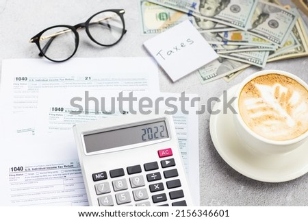 Flat lay of Individual income tax return form for tax payment on working desk. Background for Data analysis, paperwork, financial research, report. Calculation tax return in 2022 Royalty-Free Stock Photo #2156346601