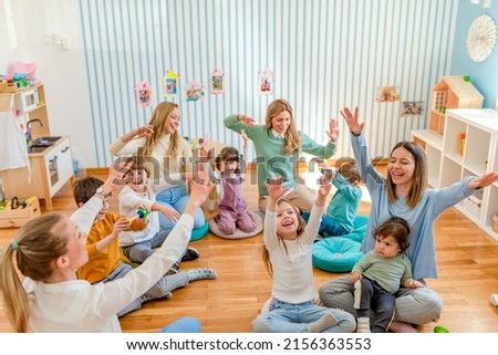 Parents taking part in the activities for preschool children. Healthy learning environment. Teacher and parents working together. Royalty-Free Stock Photo #2156363553