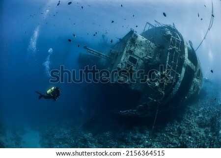 Divers exploring the shipwreck in the Jordan Red Sea Royalty-Free Stock Photo #2156364515