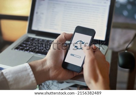install update of operating system on mobile smartphone, upgrade concept Royalty-Free Stock Photo #2156382489