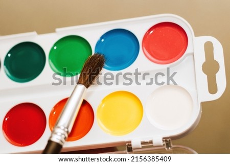 Watercolor children's multicolored paints for drawing with a brush.