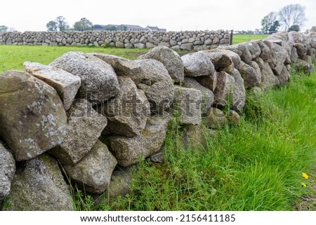 Traditional dry stone walls, common around the Mourne Mountains, Northern Ireland. Royalty-Free Stock Photo #2156411185