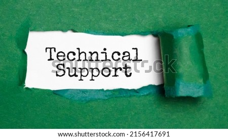 Technical support words on the green torn paper