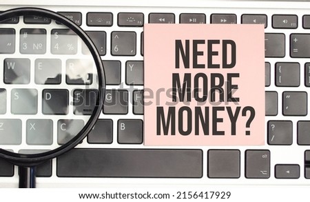 Text need more money on white paper on laptop computer