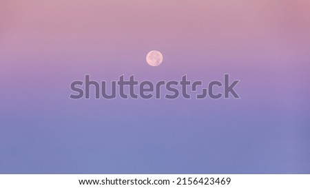 Atmospheric moonrise great for nature desktop background use or sky replacement for real estate photography with beautiful pastel colors