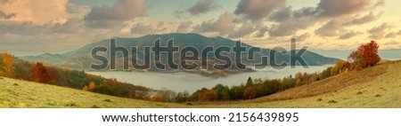 Ukraine. A magical autumn sunrise, with mist creeping over valleys, over mountain formations far from civilization. Synevyr pass located in the Carpathian mountains.