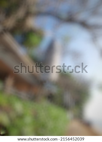Defocused or blurred abstract background of the wooden hanging lamp beside the beach