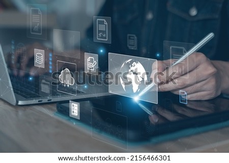 Business analysis using technology, documents virtual touch screen. Man working on laptop computer on desk in office. Data Discovery, Big Data Management, Cloud computing, Database Access, Security. Royalty-Free Stock Photo #2156466301