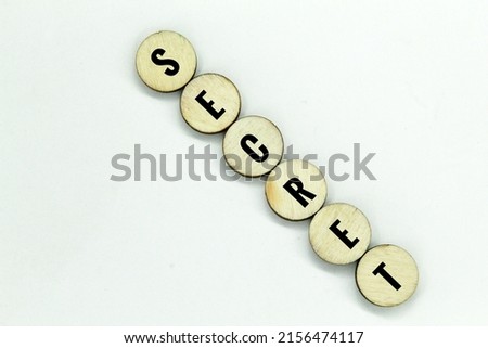 round sticks arranged with secret words. the concept of secrecy Royalty-Free Stock Photo #2156474117