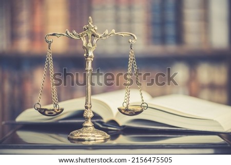 Legal office of lawyers, justice and law concept : Retro balance scale of justice on a desk in a courtroom, depicting giving fair and objective consideration to all evidence, without showing bias. Royalty-Free Stock Photo #2156475505