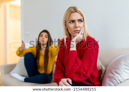 Woman apologizes to her friend after fight. Repentant woman hope for forgiveness from sad pensive friend. Royalty-Free Stock Photo #2156488215