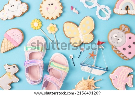 Bright summer background. Cute summer symbols on blue background. Top view, Flat lay. Creative summer concept.