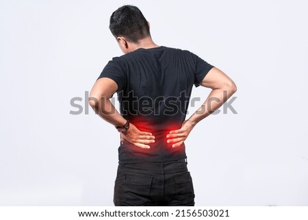 People with spine problems, man with back problems on isolated background, lumbar problems concept, a sore man with back pain Royalty-Free Stock Photo #2156503021
