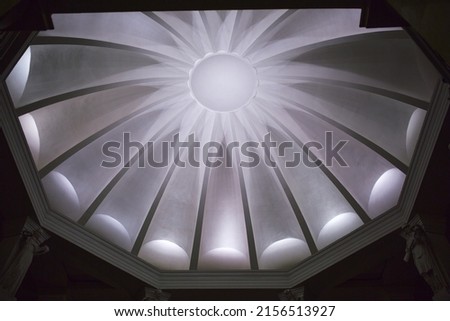Ceiling lighting in the form of a circle. The picture shows most of the circle.