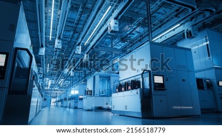 Wide Shot Inside Advanced Semiconductor Production Fab Cleanroom with Working Overhead Wafer Transfer System  Royalty-Free Stock Photo #2156518779