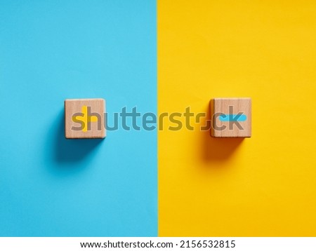 Pros and cons or strengths and weaknesses concept. Plus and minus symbols on blue and yellow background. Royalty-Free Stock Photo #2156532815