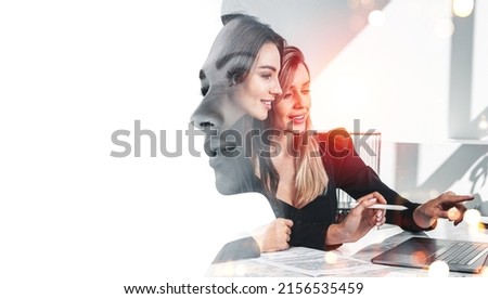 Office women working together, laptop on desk in business room, double exposure, woman pensive profile silhouette. Concept of business teamwork Royalty-Free Stock Photo #2156535459