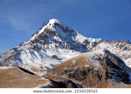 Mountain peak at day landscape. Snow on mountain peak. Landscape of mountain peak. Mountain peak snow over blue sky in winter Royalty-Free Stock Photo #2156538165