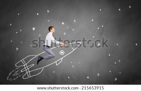 Young businessman flying in sky on drawn rocket