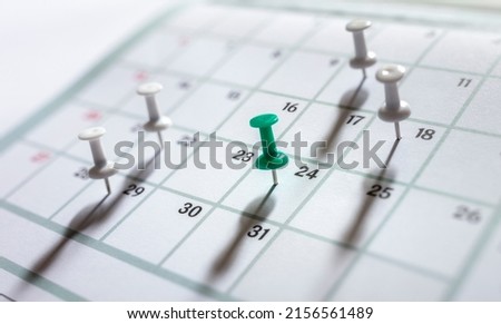 Thumbtack in calendar concept for busy, appointment and meeting reminder Royalty-Free Stock Photo #2156561489