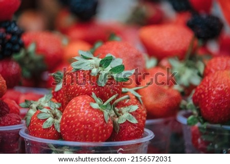 Selective focus. fresh strawberries, raspberries and blackberries in a glass. Summer Beach Food