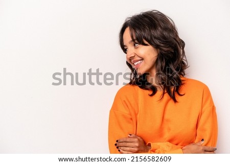 Young hispanic woman isolated on white background smiling confident with crossed arms.