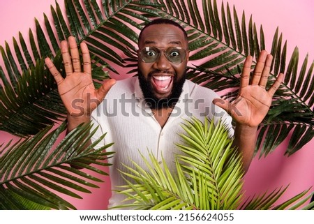 Photo of impressed funky guy dressed white shirt dark glasses rising arms having journey isolated pink color background
