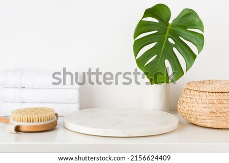 Spa concept for product display montage with white stone pedestal Royalty-Free Stock Photo #2156624409