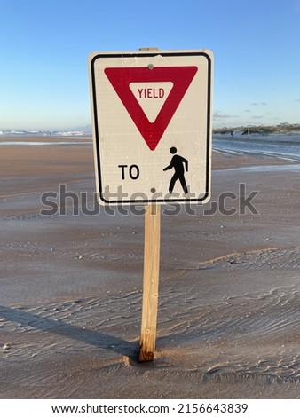Yield to pedestrian sign on Sandy Beach in the daytime