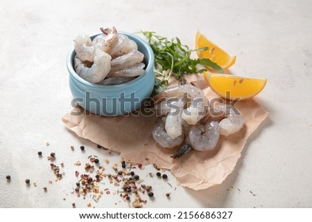 Fresh shrimp tails isolated. Raw headless prawn, pacific shrimp, uncooked prawns, seafood on white background Royalty-Free Stock Photo #2156686327