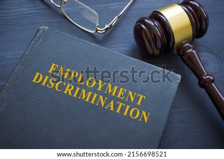 Law about employment discrimination and gavel on the table. Royalty-Free Stock Photo #2156698521
