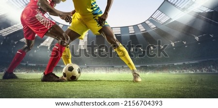 Cropped image of two soccer, football players in motion, action at stadium during football match. Concept of sport, competition, goals. Collage, poster for ads. Crowded stadium effect