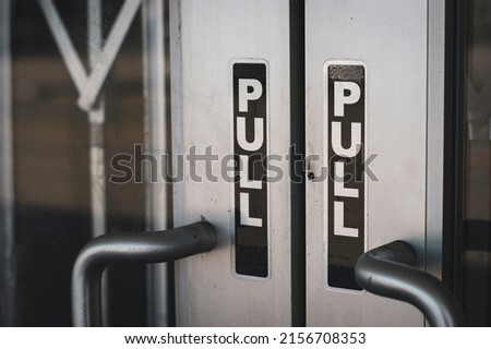 Close-up of door with pull sign