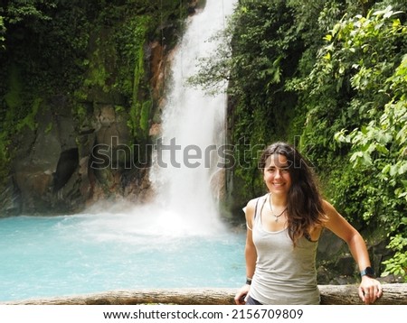 young woman in rio celeste waterfall