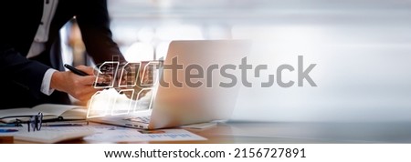 Businesswoman working on a laptop computer to document management online documentation database digital file storage system software records keeping database technology file access doc sharing. Royalty-Free Stock Photo #2156727891
