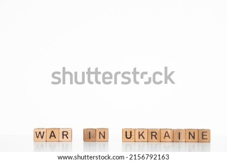 War in Ukraine, word on wooden blocks. Isolated on a white background.
