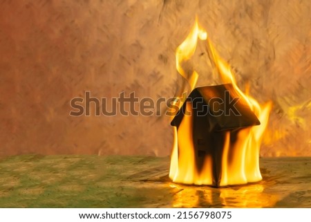 the house is on fire. a toy house engulfed in flames. background picture.
