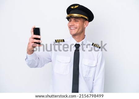 Airplane caucasian pilot isolated on white background making a selfie