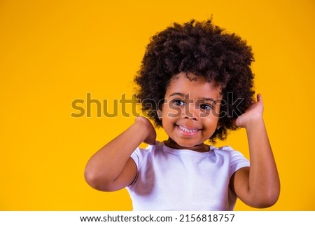 Beauty portrait of little afro girl with afro hairstyle. Adorable little girl with blackpower hair Royalty-Free Stock Photo #2156818757