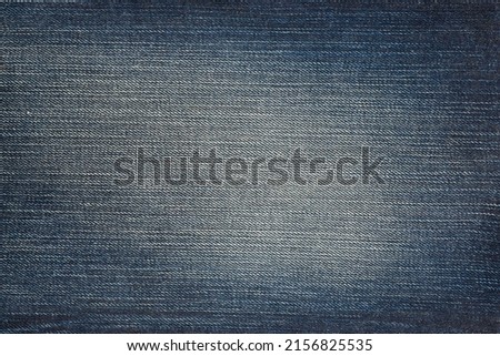 Texture of dark blue jeans, detail cloth of denim for pattern and background, Close-up