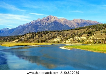 Landscape view of The Steeples in the Canadian Rockies with the Bull River in the East Kootenay near Cranbrook, British Columbia, Canada  Royalty-Free Stock Photo #2156829065