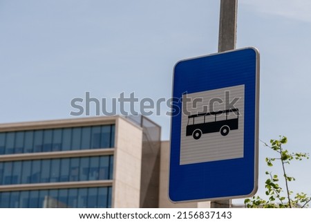 A bus parking sign on the street