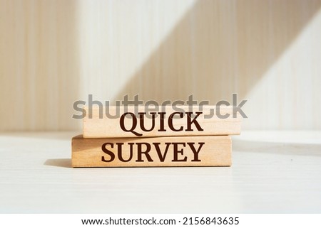 Wooden blocks with words 'QUICK SURVEY'. Business concept