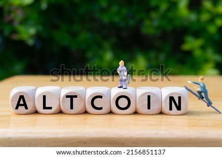 ALTCOIN.concept of virtual currency mining . Digital currency and virtual assets theme.Defi.written word on dice,miniature workers digging.