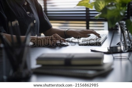 Close up view woman hands typing on computer.	