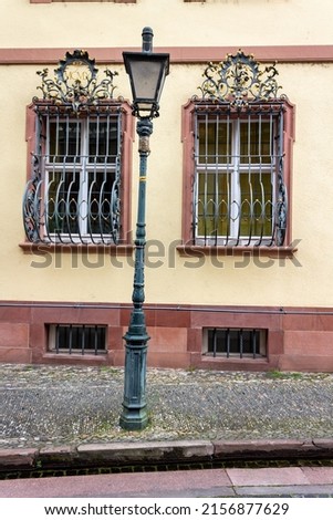 A vertical shot of detail of the facade of the typical historic buildings in downtown Freiburg, Germany, Europe