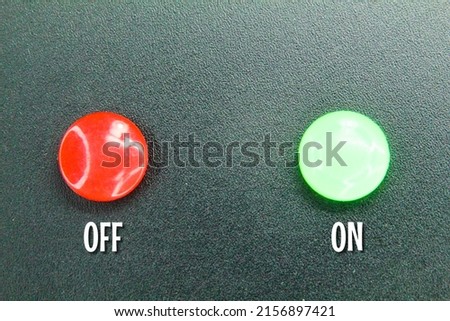 the switch buttons are red and green. switch the green button on and the red button off Royalty-Free Stock Photo #2156897421